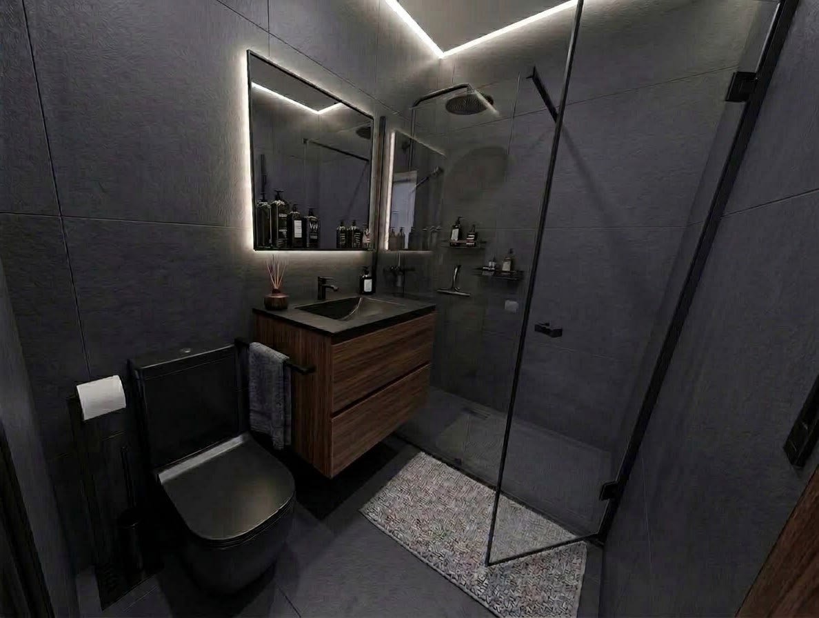 Baño moderno en tonos oscuros con mueble de madera, ducha con mampara y espejo retroiluminado